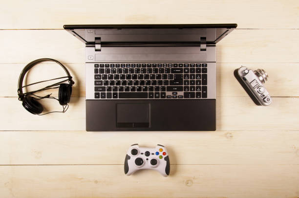 istock Office desk, computer, headphones and gamepad 839932098