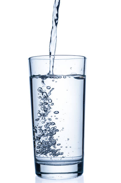 istock Flowing pure water into tumbler on white background 839938560