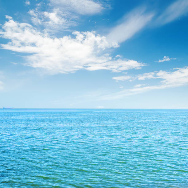istock blue sea and white clouds in sky 839941868