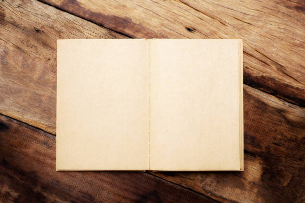 istock Vintage brown notebook on wooden table 839944122
