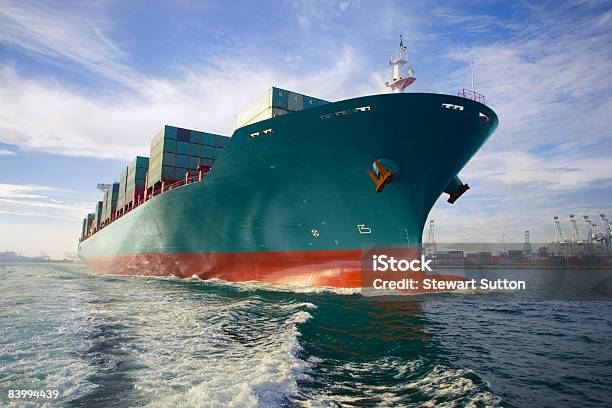 Bow View Of Loaded Cargo Ship Sailing Out Of Port Stock Photo - Download Image Now - Container Ship, Sea, Freight Transportation