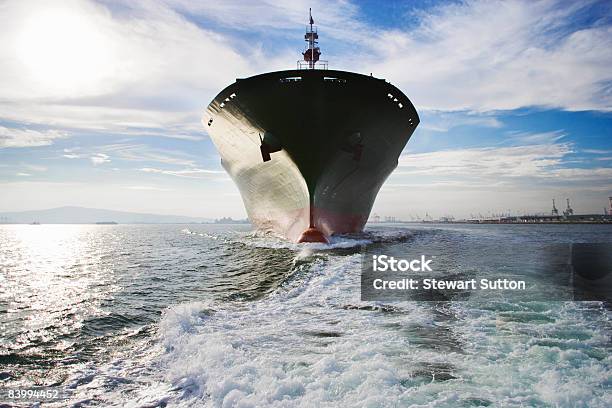 Bow View Of Cargo Ship Sailing Out Of Port Stock Photo - Download Image Now - Ship's Bow, Container Ship, Wave - Water