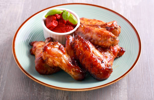 istock Roast chicken wings and tomato sauce 839945016