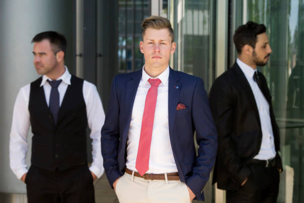 istock three handsome young businessmen standing outside 839945220