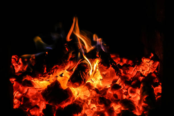istock Fire burning inside a brick stove - wood, ash, flames. 839948412