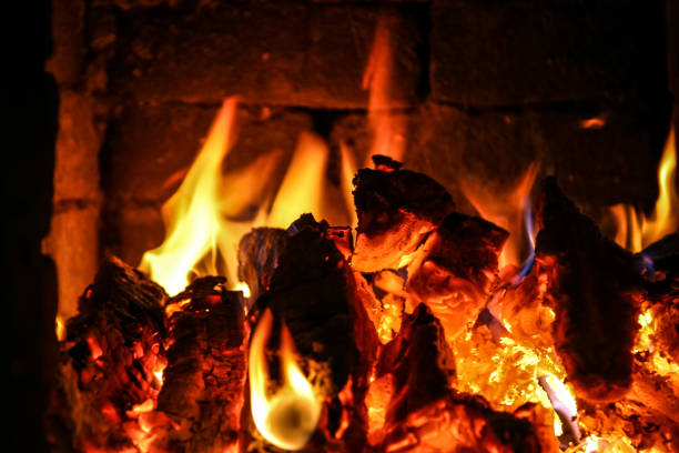 istock Fire burning inside a brick stove - wood, ash, flames. 839948464