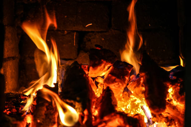 istock Fire burning inside a brick stove - wood, ash, flames. 839948466