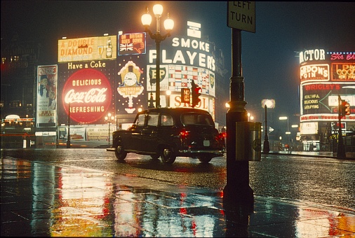 London, England, UK, 1962. The Piccadilly Circus at night and fog.