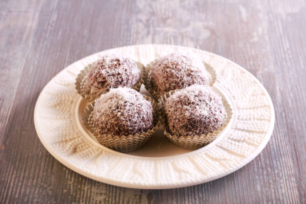 istock Homemade fruit candies covered with chocolate and shredded coconut 839949450
