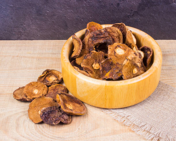 istock Dried forest mushrooms on a wooden table. 839951754
