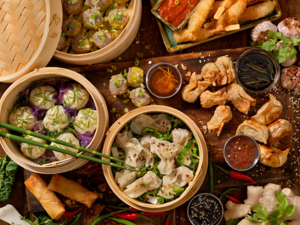 Dim Sum Asian Appetizers, Dumplings, Spring Rolls, Shrimp, Wontons, Dry Ribs and Sauces chinese dumpling photos stock pictures, royalty-free photos & images