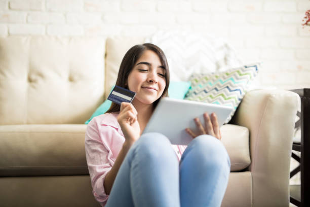 istock Cute woman having fun shopping online 839958926