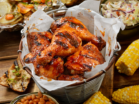 BBQ Chicken Feast with Corn on the Cob, Baked Beans, Coleslaw, Potatoes, Carrots and Grilled Bread