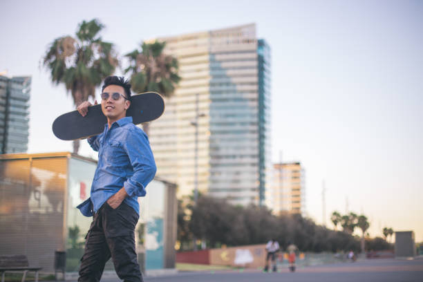 istock Chinese young man with skateboard 839980056