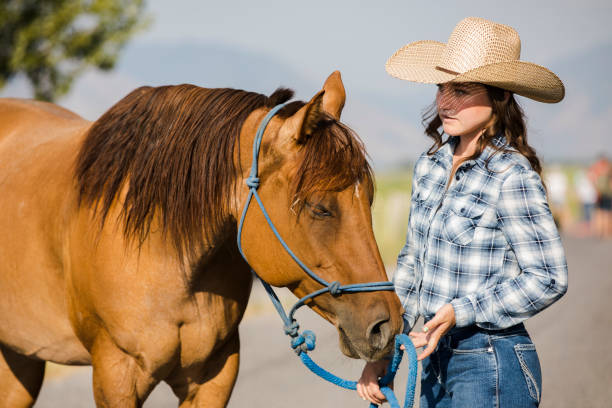 istock Cowgirl with her Horse 839983012