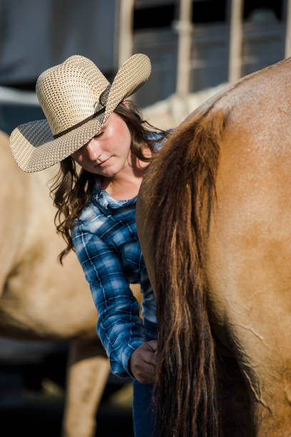 istock Cowgirl with her Horse 839983070