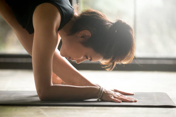 istock Young attractive woman in Parsvottanasana, Pyramid pose, studio background 839986038