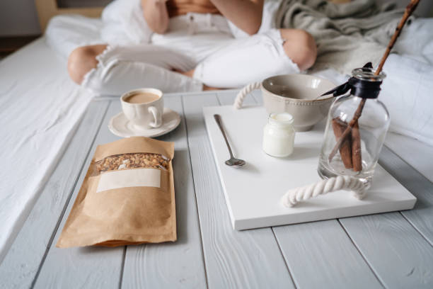 istock Woman eating cereals in bed 839986740