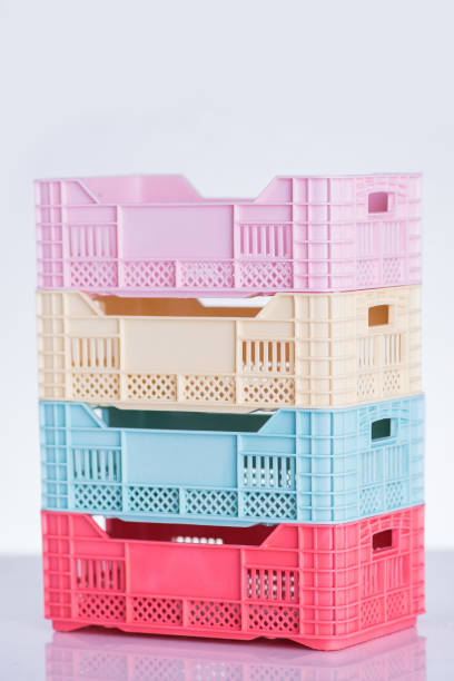 пастельные цветные пластиковые ящики - vegies vegetable basket residential structure стоковые фото и изображения