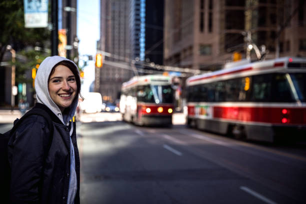 istock Beautiful young woman in downtown Toronto 839992602