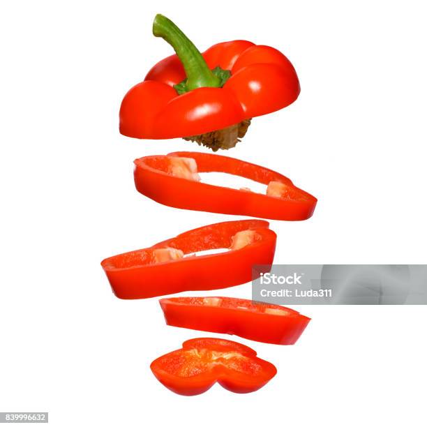 Creative Concept With Flying Red Paprika Sliced Floating Pepper Isolated Stock Photo - Download Image Now