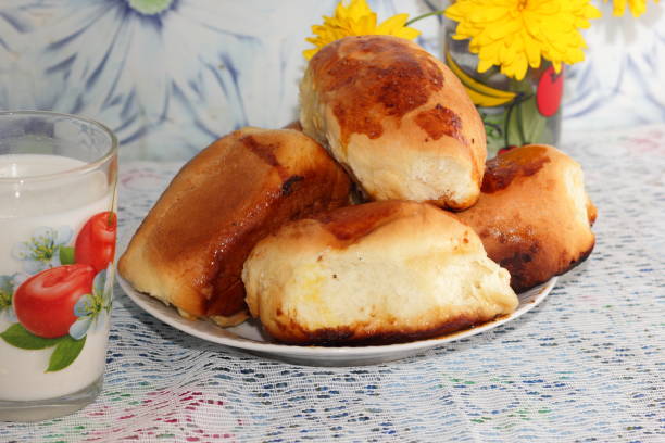 Still life with sweet pies and a can of honey