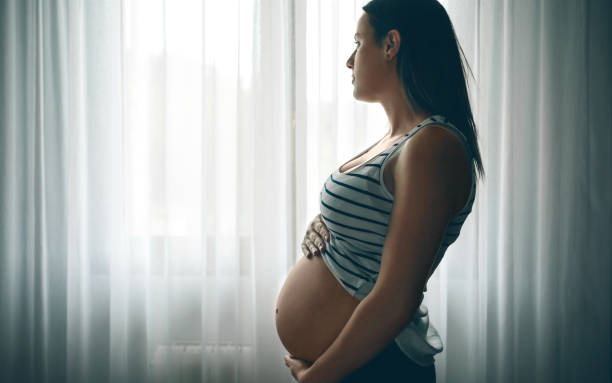 istock Pregnant caressing her nacked belly 840024412