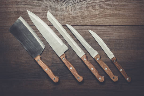 istock kitchen knifes on the brown wooden table 840038486