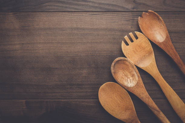 istock wooden spoons on the blue table 840041122