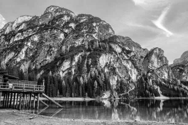 istock mountain lake with wooden house 840044702