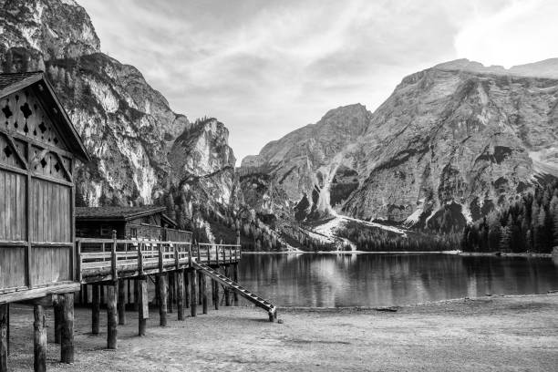 istock mountain lake with wooden house 840044714