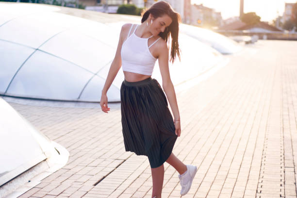 istock Young woman dancing in a street 840047530