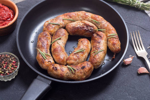 istock Homemade grilled sausages in pan 840047752