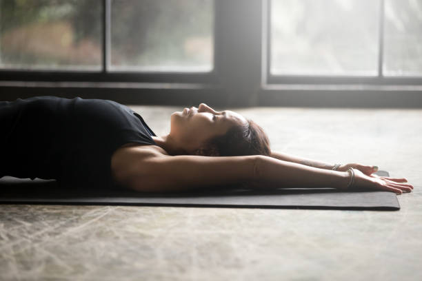 istock Young attractive woman stretching on the mat 840048092