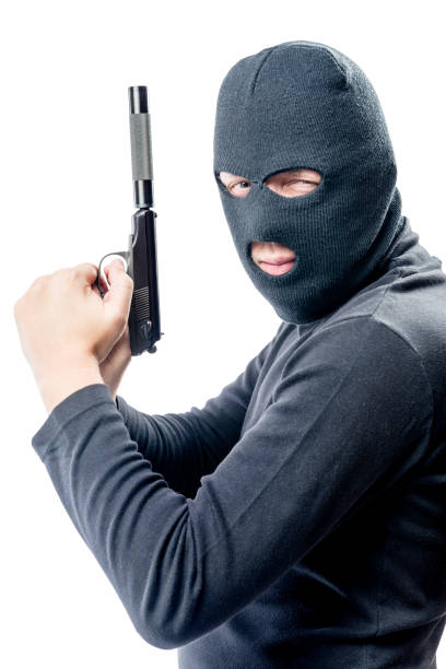 istock Armed and very dangerous assassin in a balaclava on a white background 840052020