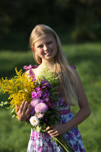 istock Girl and flowers 840052970