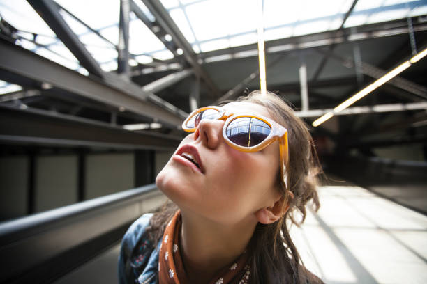 istock Woman on station platform looking up 840053296