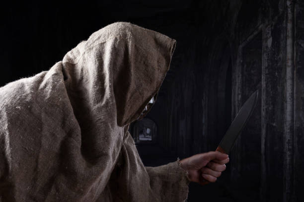 istock Man in iron mask with a big knife . 840055620