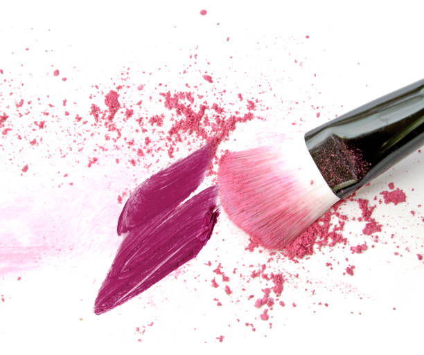 istock Purple and pink make up powder, lipstick smear with brush 840056598