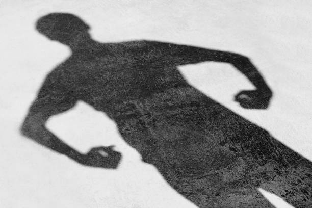 istock Shadow of a man on the ground texture 840063842