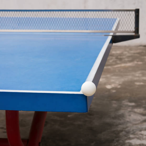 istock white pingpong ball hits the corner of a blue pingpong table 840063854