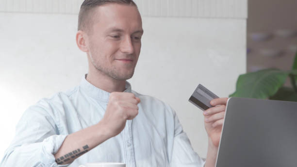 istock Man made successful online purchase with credit card 840064240