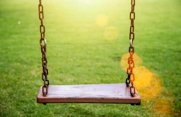 istock empty wood seat on swing outdoor game 840067184