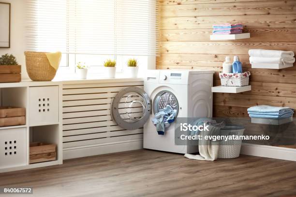 Interior Of Real Laundry Room With Washing Machine At Window At Home Stock Photo - Download Image Now