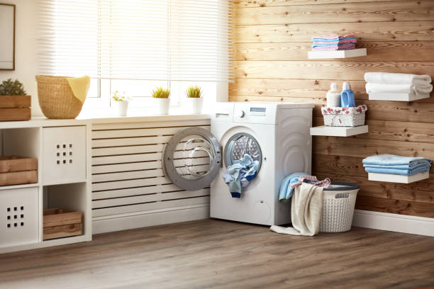 interior of real laundry room with  washing machine at window at home - contemporary indoors lifestyles domestic room imagens e fotografias de stock