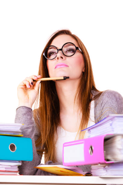 istock Woman sitting at desk in office and thinking 840067664