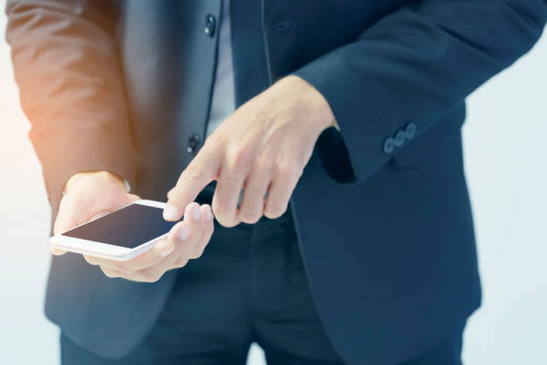 istock closeup of a businessman using a smartphone 840067712