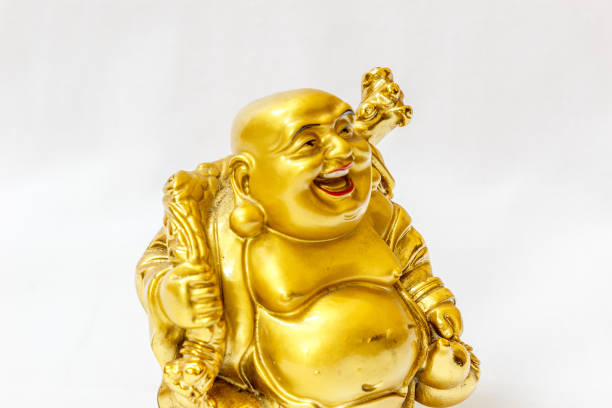 istock Laughing Buddha painted in gold colour with white backdrop 840068580