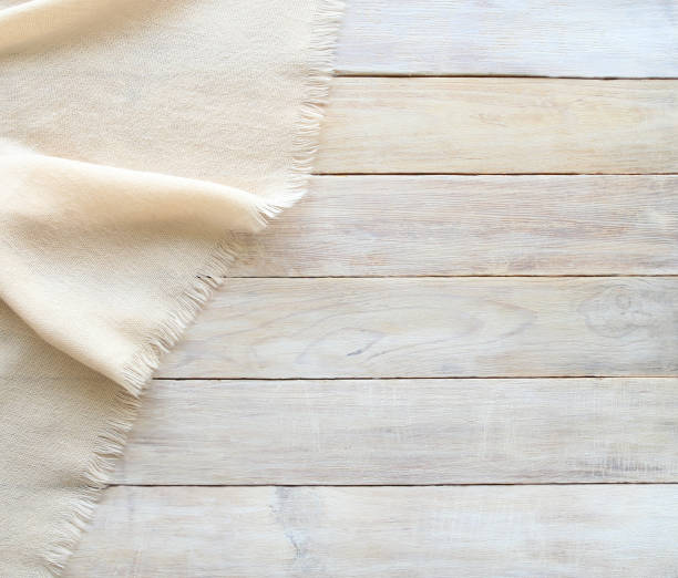 istock Knitted material and grunge wood board texture background. 840068666