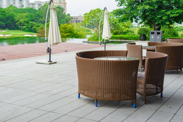 istock rattan sofa and table set in a garden with lake 840073422